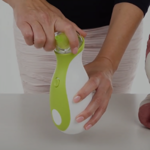 A woman showing how to assemble the Nosiboo Go Portable Nasal Aspirator.