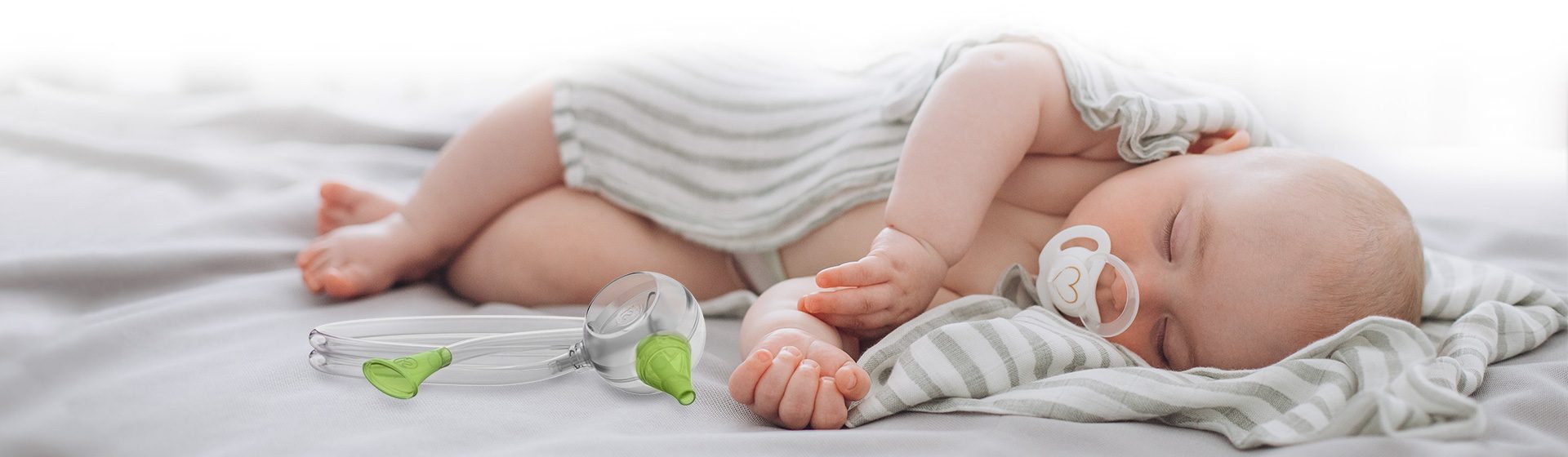 Dowiedz się więcej o ustnym aspiratorze do nosa dla niemowląt Nosiboo Eco, który oczyszcza nosek korzystając z siły Twoich płuc